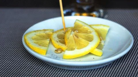 Brandy with lemon. Stock Photos