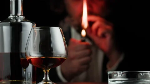 brandy cigarette Brandy or whiskey and cigar close-up. Rich man smoking cigarette. Luxury  cognac