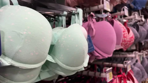 Bras hang on a rack in a women's lingeri, Stock Video