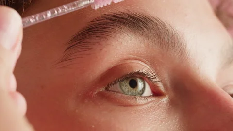 Brashing eyebrows close-up. The master makes permanent eyebrow makeup Stock-Footage 259224762