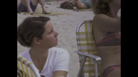 Brasil 1976, Beachgoers of Rio: Capturing the Vibrant Spirit of 1970s Coast.. Stock Footage 242322924
