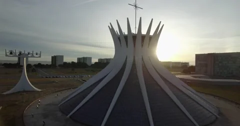 Brasilia aerial circling wide around the Cathedral revealing rising sun Stock Footage