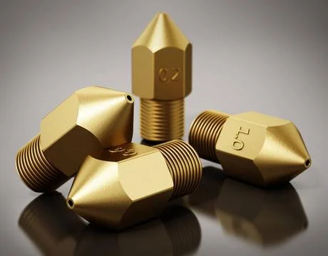 Brass 3D printer nozzles isolated on gray background. 3D illustration Bras... Stock Photos