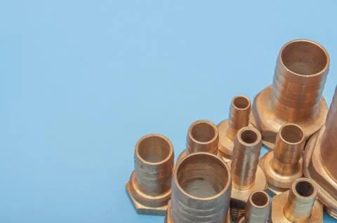 Brass adapters of different diameters, to connect the hose and thread. Stock Photos