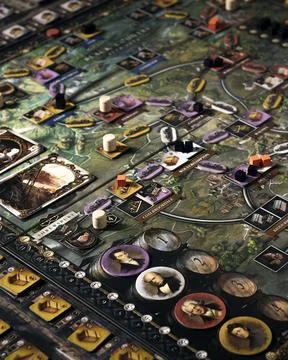 Brass Birmingham board game components close up with tokens tiles main boar.. Foto stock