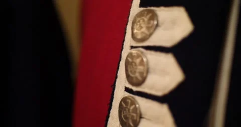 Brass buttons and decorative braid on the front of a uniform Stock Footage 151504143