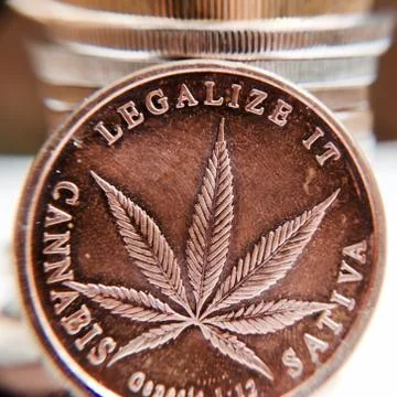 Brass cannabis coin Stock Photos