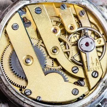 Brass clockwork of old mechanical pocket watch watchmaker workshop - brass... Stock Photos