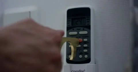 Brass Contactless Hygiene Tool Pressing Air Conditioner Remote, Close Up Shot Stock Footage 341328531