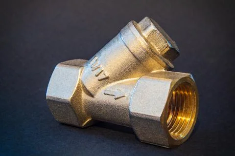 Brass filter for hot or cold water used in plumbing when connecting pipes Stock Photos