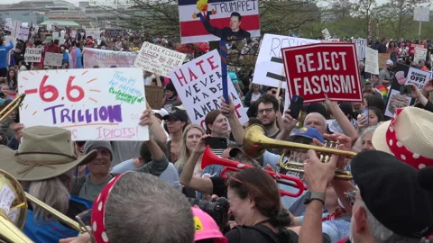 Brass impromptu band energizes demonstrators, Hand Off rally, DC Stock Footage 306081291