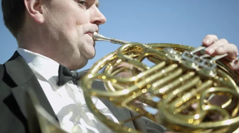Brass instrument section of an orchestra performing outdoors. Stock Footage 50503853