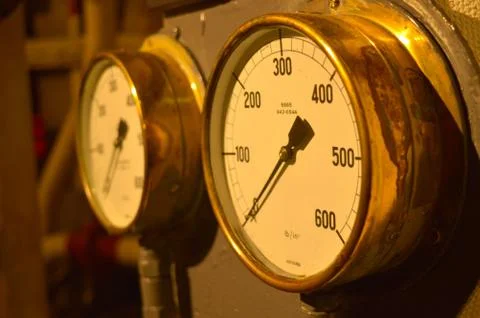 Brass instruments on an old instrument panel Stock Photos