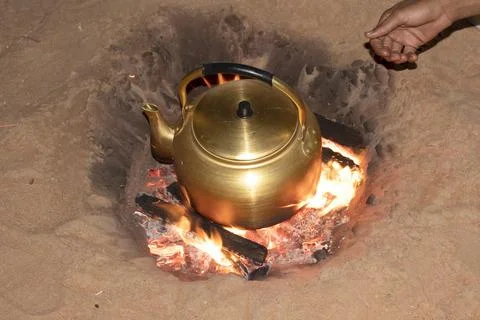A brass kettle in a campfire 写真素材