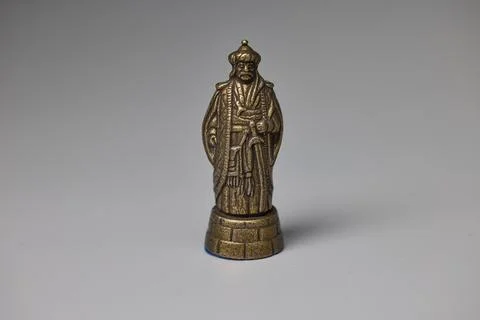 Brass king chess piece representing strategy game Foto stock