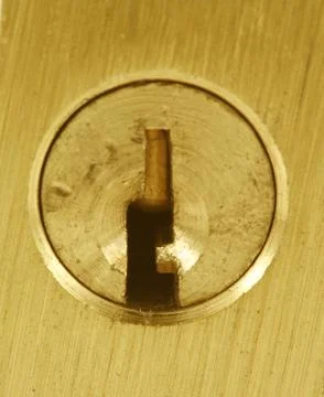 Brass lock keyhole macro Stock Photos