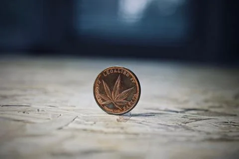 Brass marijuana coin Stock Photos