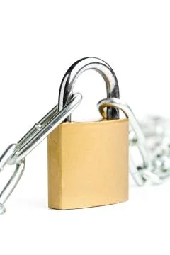 Brass padlock connecting two chains over white background Stock Photos