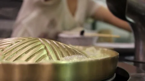 Brass pan with boiled vegetable before cooking Stock Footage 220764969