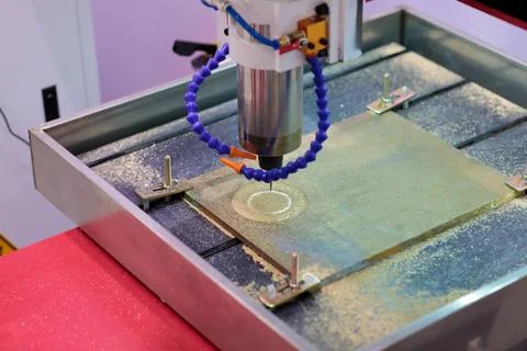 Brass plate processing with CNC milling machine Stock Photos