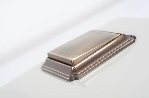 Brass retro light switch on the wall Stock Photos