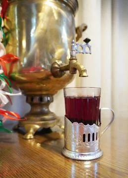 Brass samovar with a cup of tea. Stock-Fotos