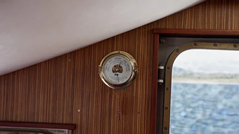 Brass Ship Barometer Beside Cabin Window at Sea Stock Footage 331940595