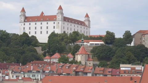 Bratislava Castle behind the red rooftops of Old Town in Slovakia Видео 285106708