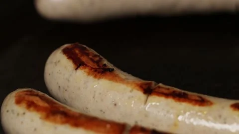 Bratwurst are fried in the pan Stockbeeldmateriaal 158250924