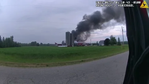 Brave Cop Rescues Three Cows Stuck Inside Burning Barn In Sturgeon Bay, WI,... Stock Footage 247513612