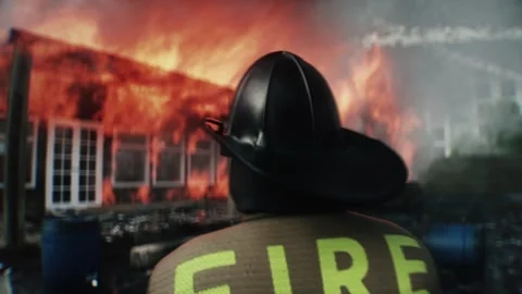 Brave Firefighter Approaching Burning House Surrounded by Flames. 스톡 동영상 336515984