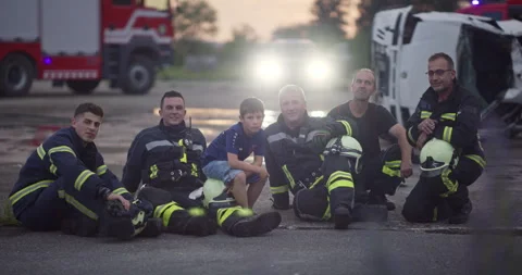 Brave Firefighters Team Walking to the Camera. In Background Paramedics and Video stock 247798598