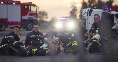 Brave Firefighters Team Walking to the Camera. In Background Paramedics and Video stock 248004766