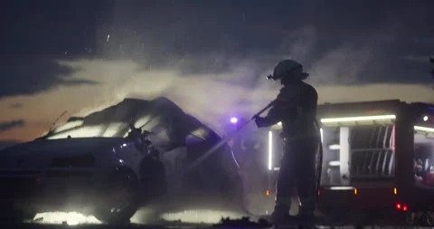 Brave Firefighters Team Walking to the Camera. In Background Paramedics and Stock Footage 283446646