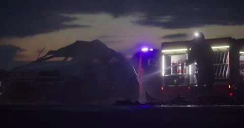 Brave Firefighters Team Walking to the Camera. In Background Paramedics and Stock Footage 283447030