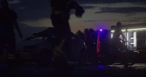 Brave Firefighters Team Walking to the Camera. In Background Paramedics and Stock Footage 283447335