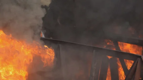 Brave firemen go through the fire Stock Footage 36055237