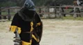 Brave knight with sword and shield in hands breathing heavily after fierce clash HD Footage