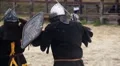 Brave knights with shields and swords showing martial skills at tournament HD Footage