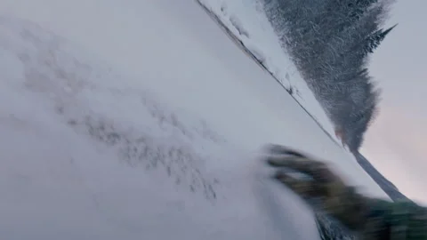 A brave man crawls across the thin ice of the river, trying to overcome it. Stock Footage 322092546