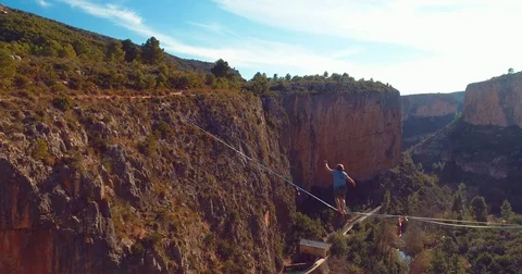 Brave Man Slacklining , highlining above a big canyon Stock Footage 85267948