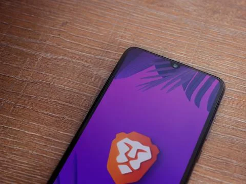 Brave Private Browser app launch screen on smartphone on wooden background Stock Photos