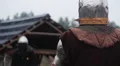 Brave warrior in steel armor waiting for enemy's attack on rainy battle field HD Footage
