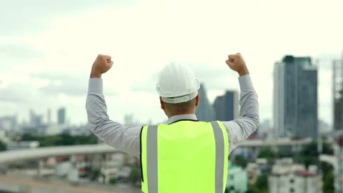 Bravo. Engineer handsome man proud of the work with white safety helmet. Stock Footage 164834452