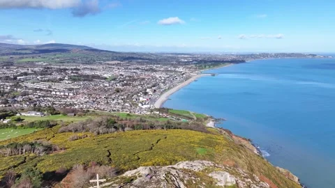 Bray town over Bray Head opening shot to the beach town in Wicklow, Ireland. Stock Footage 332626823