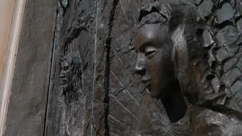 Brazen gate of a cathedral, detail of a face Stock-Footage 153814576
