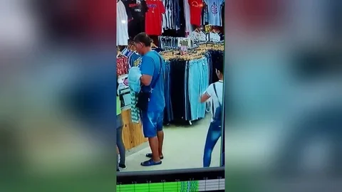 Brazen pickpocket caught on CCTV stealing from old man in Philippines Stock Footage 109388489
