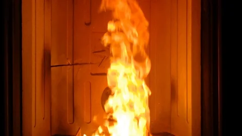 Brazier with fire lit by a pellet stove Video stock 109369299