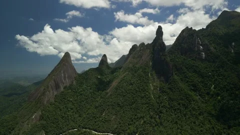 Brazil, Teresópolis. Dedo de Deus monolith and mountain road. Aerial push-in on Stock Footage 342328324