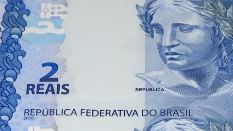 Brazil two real notes tracking. Dolly shot. Low angle, macro. 4K Stock Footage 125445592